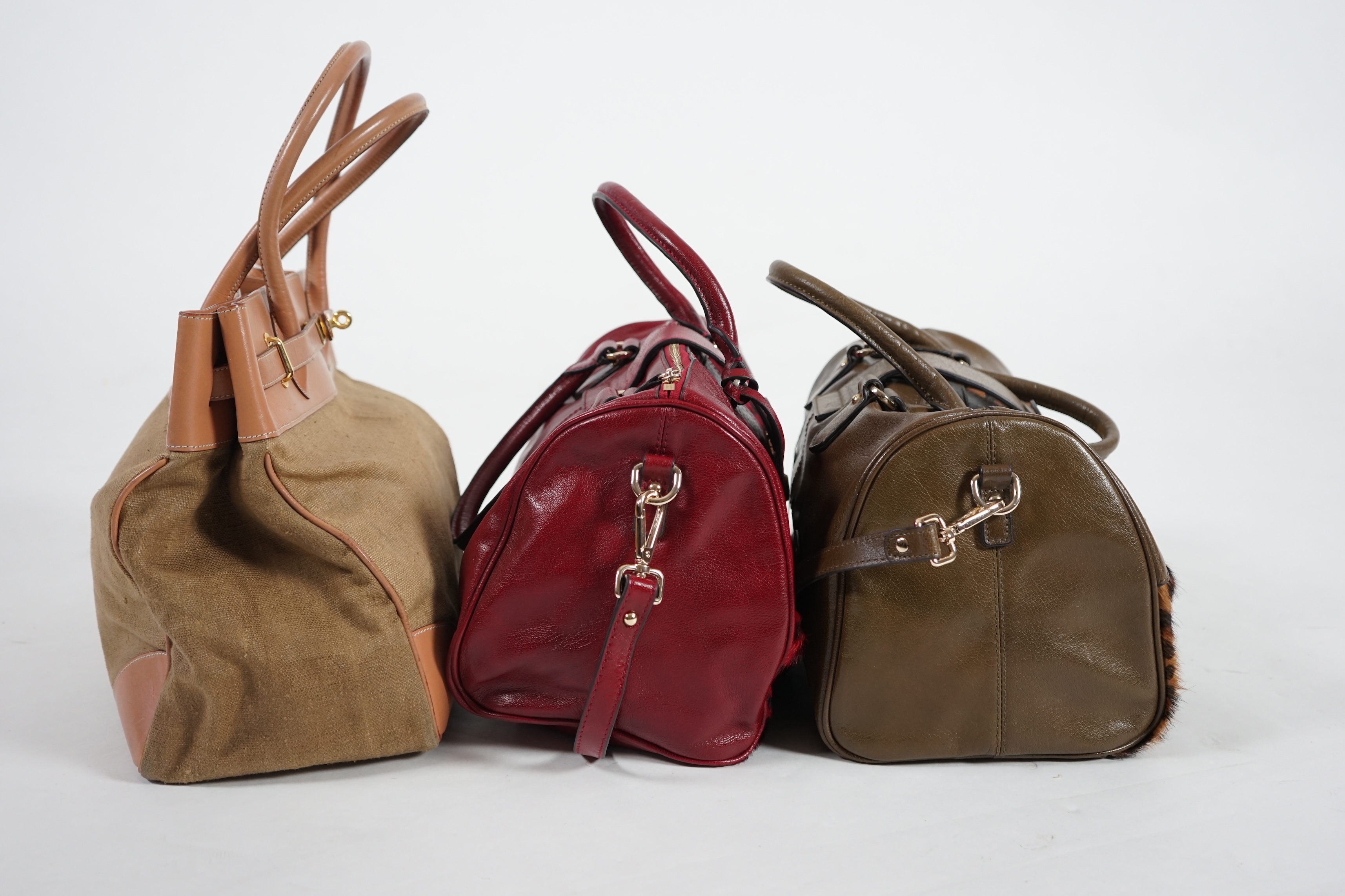 Two Maria Carla handbags and a Piertucci light tan canvas and leather bag. Proceeds to Happy Paws Puppy Rescue